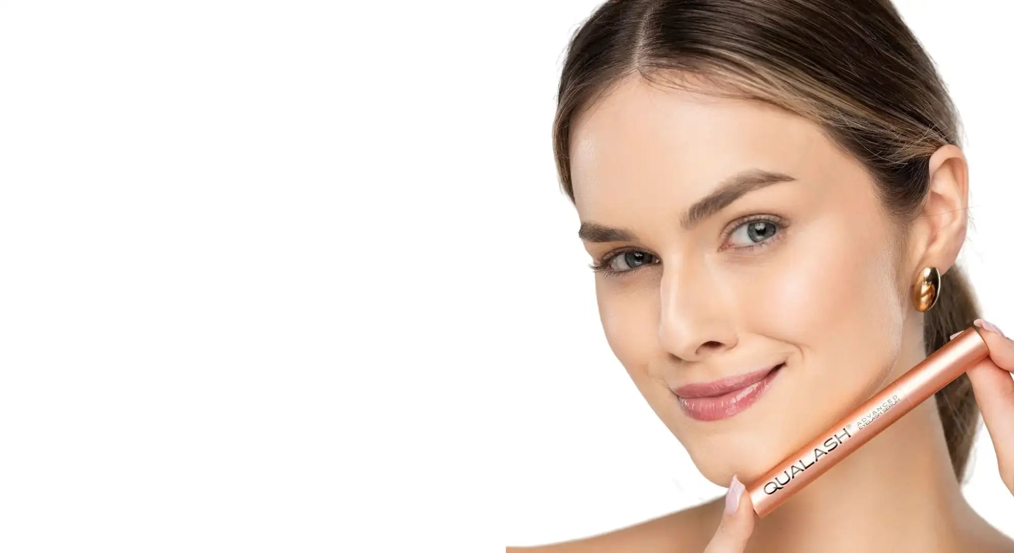 Step 1 Cleansing – woman holding QUALASH Advanced Lash Serum during eye area cleansing routine