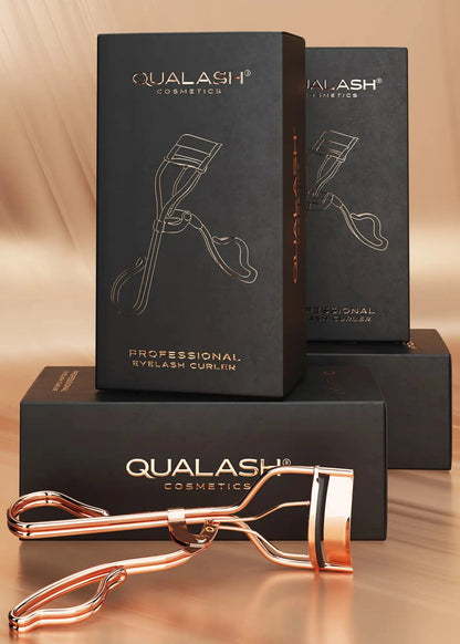 QUALASH eyelash curler with elegant black packaging – premium product presentation